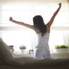 Woman waking up and stretching, Improve your morning routine by Phoenix Nutrition, 